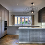 Cottage house with modern kitchen by Galerie Design kitchen showroom Warwick