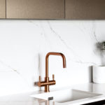 Copper Tap in a modern kitchen with marble splash back