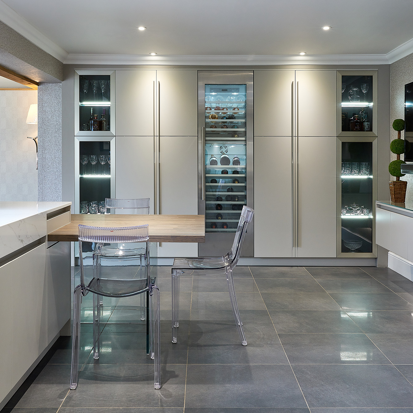 Stunning modern kitchen in Sutton Coldfield, designed by Galerie Design kitchen showroom in Warwick, Warwickshire - The kitchen features a tall wine fridge and siemens appliances with Led light in the kitchen