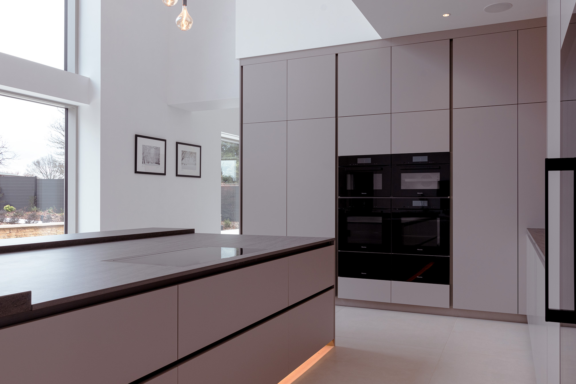 Modern home in Northamptonshire with a luxury Italian contemporary kitchen with a large kitchen island, Miele appliances and Novy hob