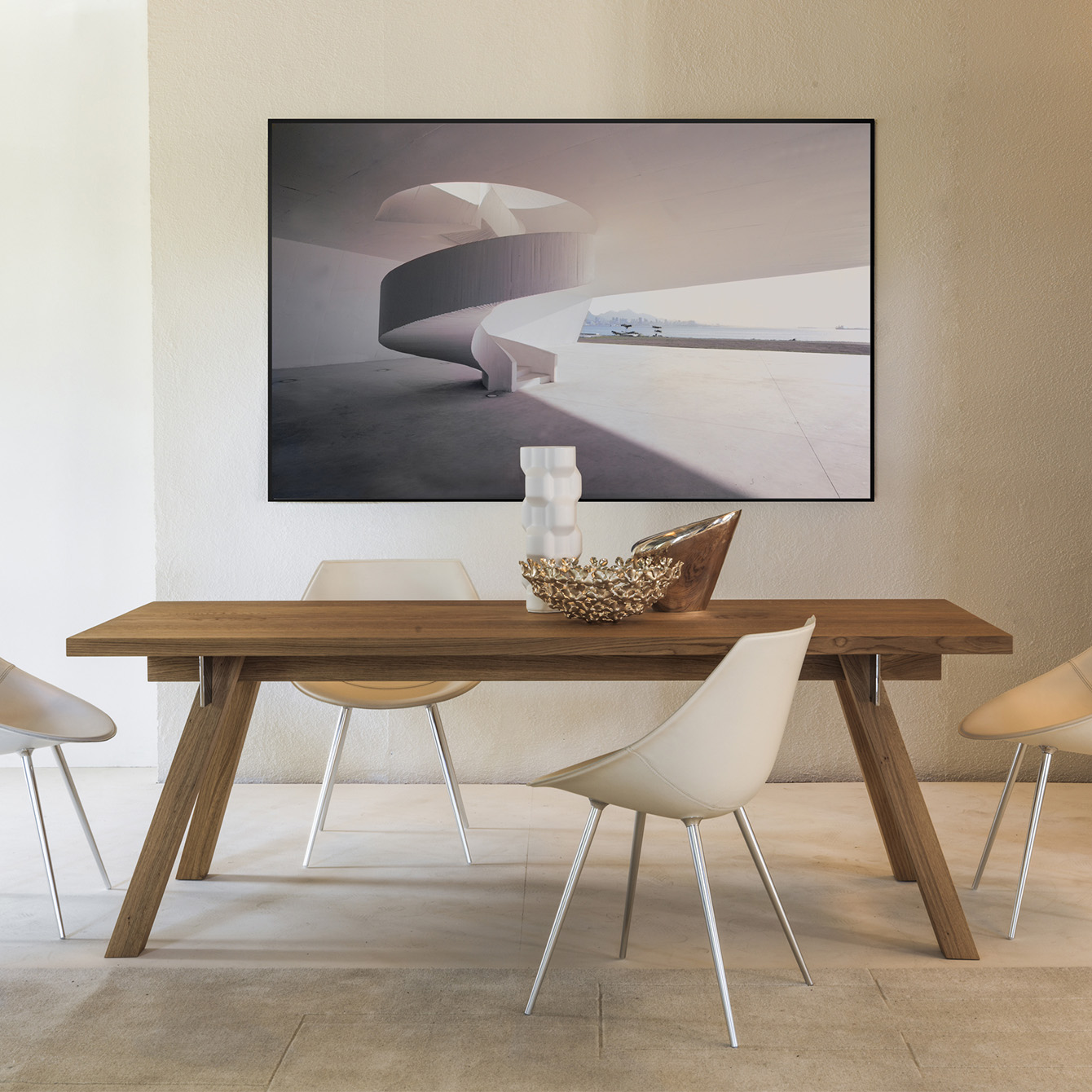 Wood dining table with modern chair, rug and artwork